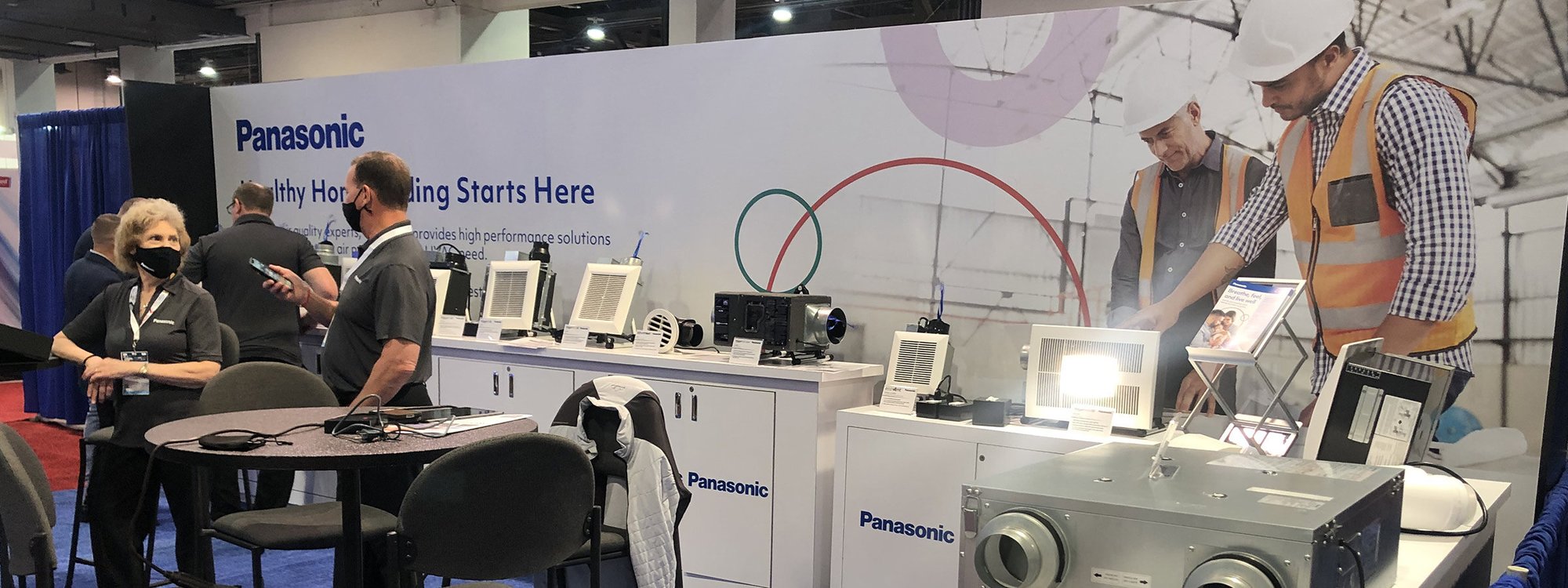 A selection of Panasonic products displayed at a trade show booth