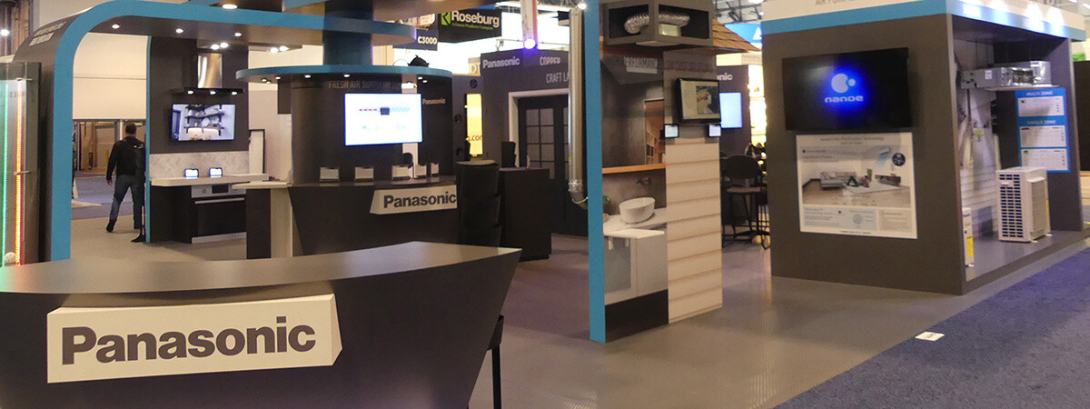 A large Panasonic trade show booth featuring many products