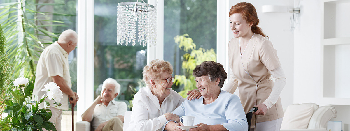 Seniors and staff interact in a retirement community