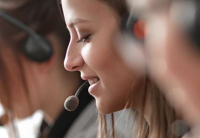 Woman talking into microphone headset