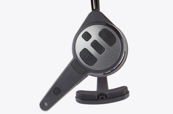 Black headset with integrated control buttons on a stand.