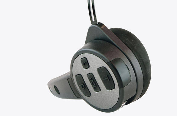 Black electronic device with buttons and cable, possibly a remote or controller.