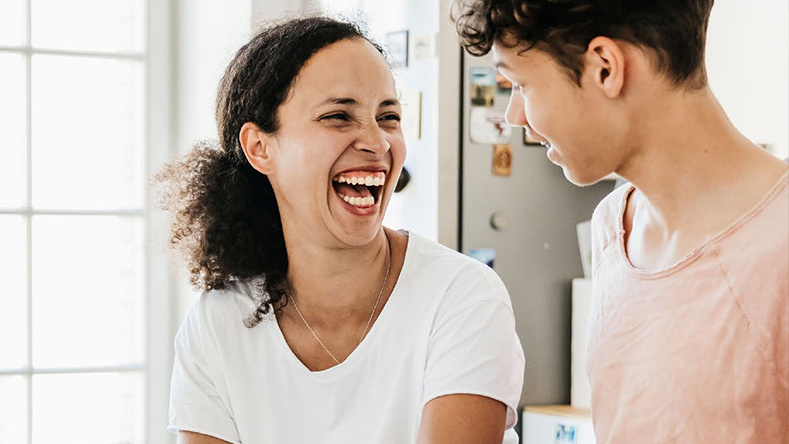 A woman laughs