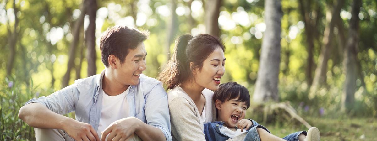 Parents and child in the woods