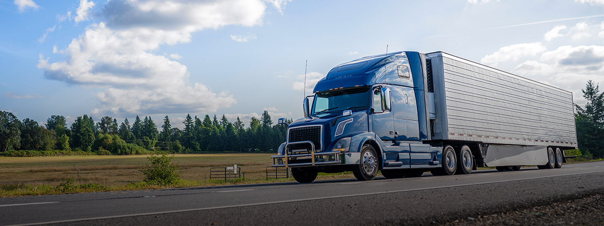Large transport truck driving down a highway
