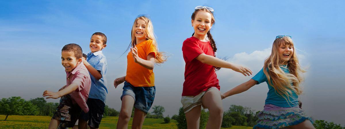 A group of kids run outside