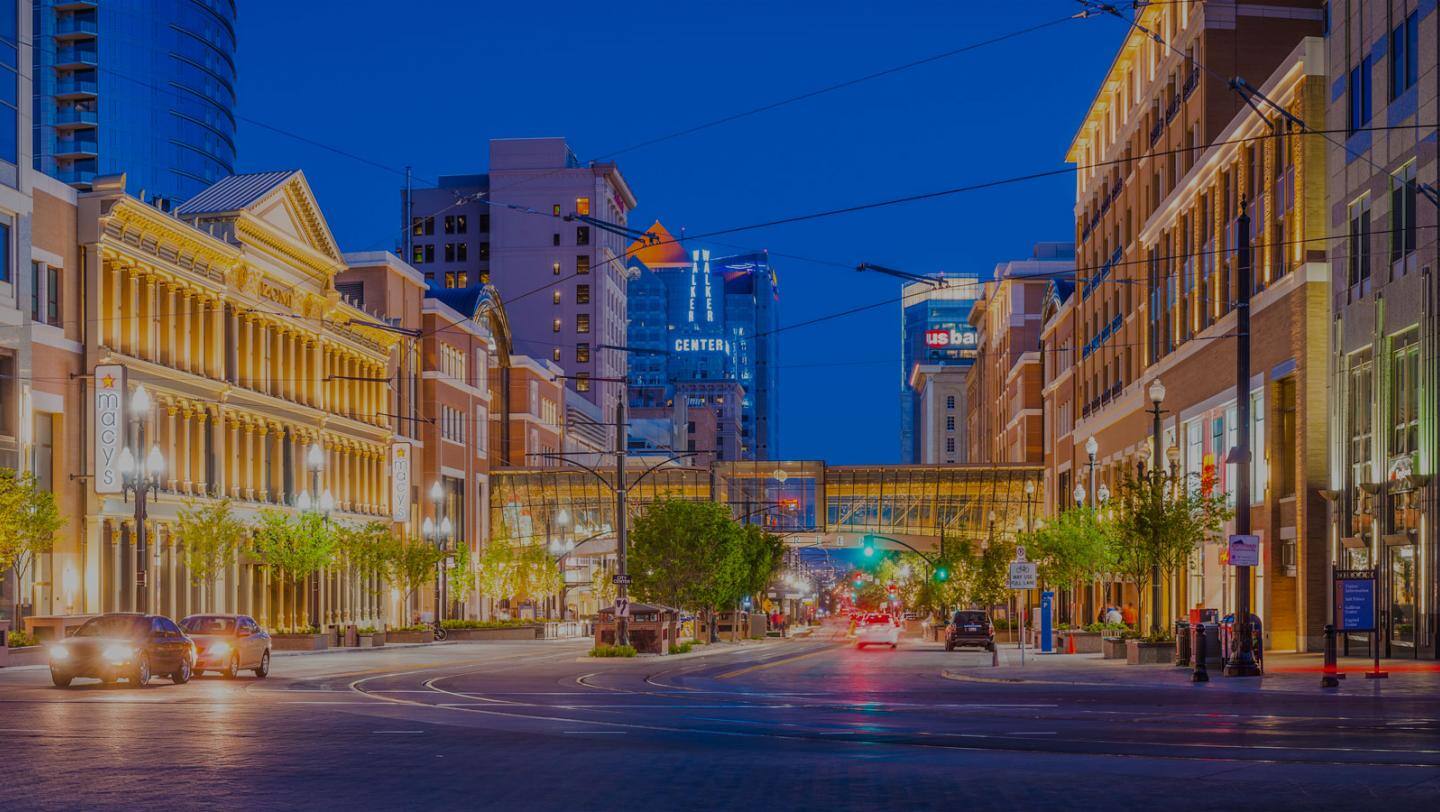 A lit up city street at night