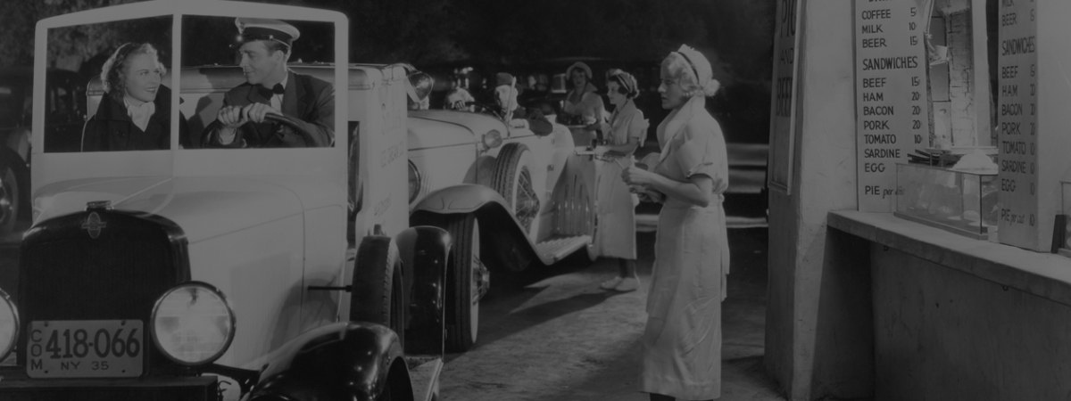 black and white photo of 1950's drive thru