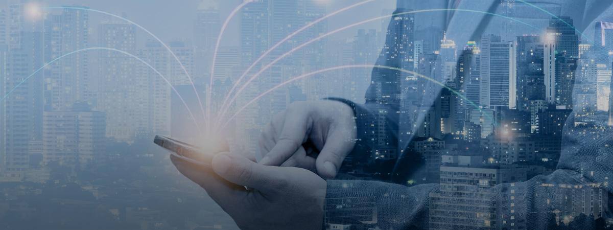 Hands hold a smartphone, which sprouts arcing lines representing connections