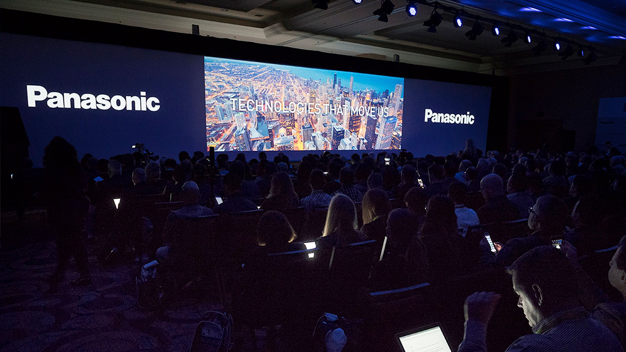 People at a Panasonic Conference watching a presentation