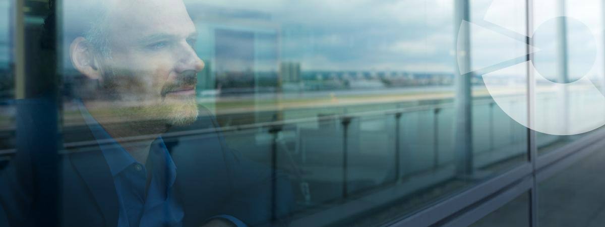 Man looking out a window