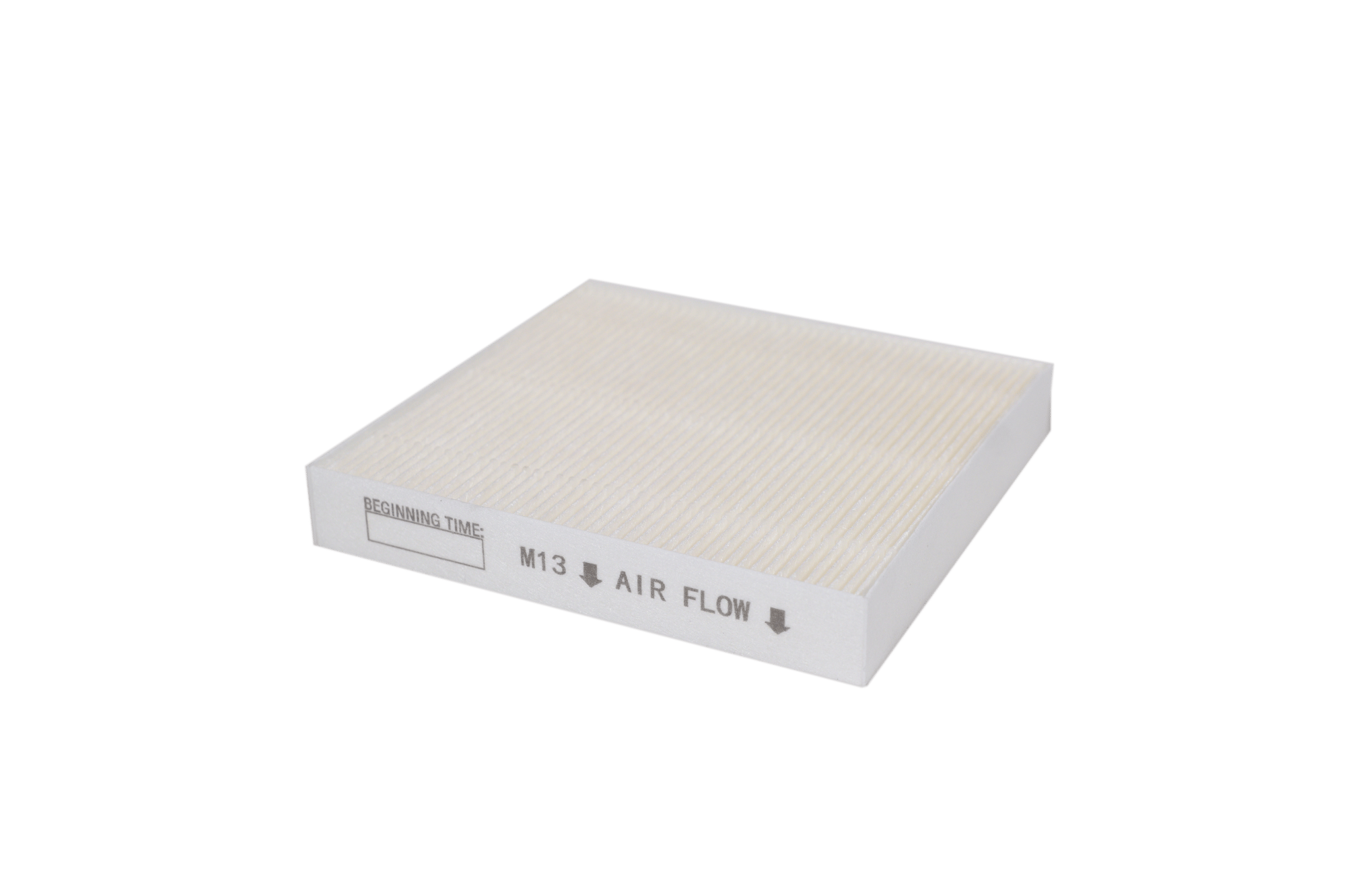 White square air filter with small writings on the side.