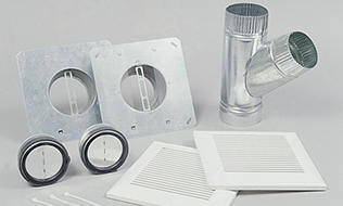 Ventilation installation kit with duct pieces and grilles.