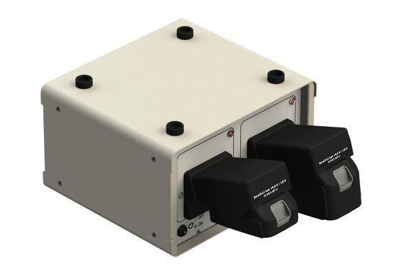 Battery charger with two black charging bays attached to a gray base.