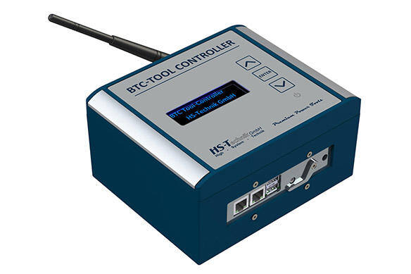 Blue and gray BTC Tool Controller with digital display and antenna.
