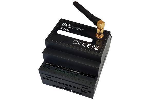 Black controller device with antenna and labeled connections.