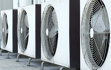 Compressor fan lined up in a row mounted to concrete