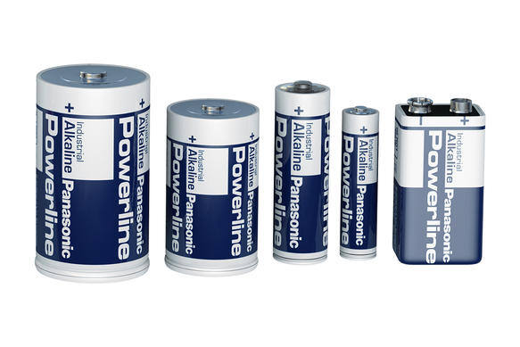 Assorted Panasonic Powerline alkaline batteries on white background.