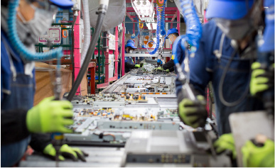 Workers on an assembly line