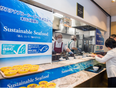 Customers being served at sustainable seafood counter