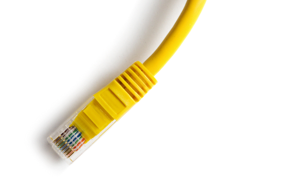 Yellow Ethernet cable with connector on white background.