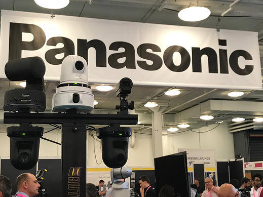 Panasonic camera equipment displayed at a trade show booth.