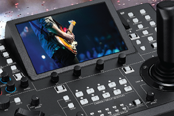 PTZ camera controller with integrated monitor and multiple control buttons.