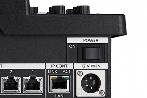 Close-up of a controller with power and network connectivity ports.
