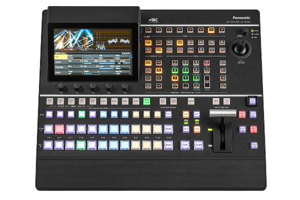 Professional video production switcher with multiple buttons and a display screen.